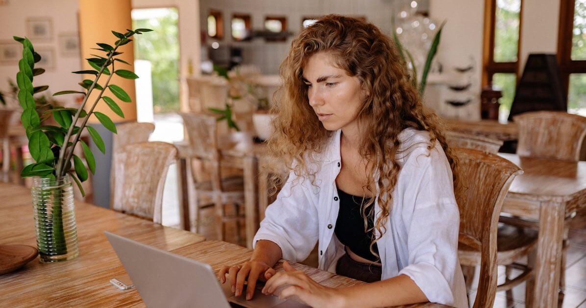 beautiful woman with curly hair fighting with consistent writing enemies