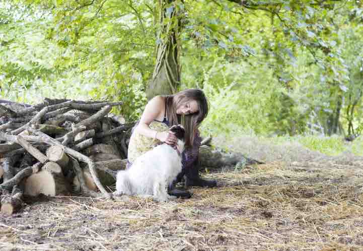 dog-and-its-owner-sitting-the-woods-finding-bliss-in-simplicity.jpg